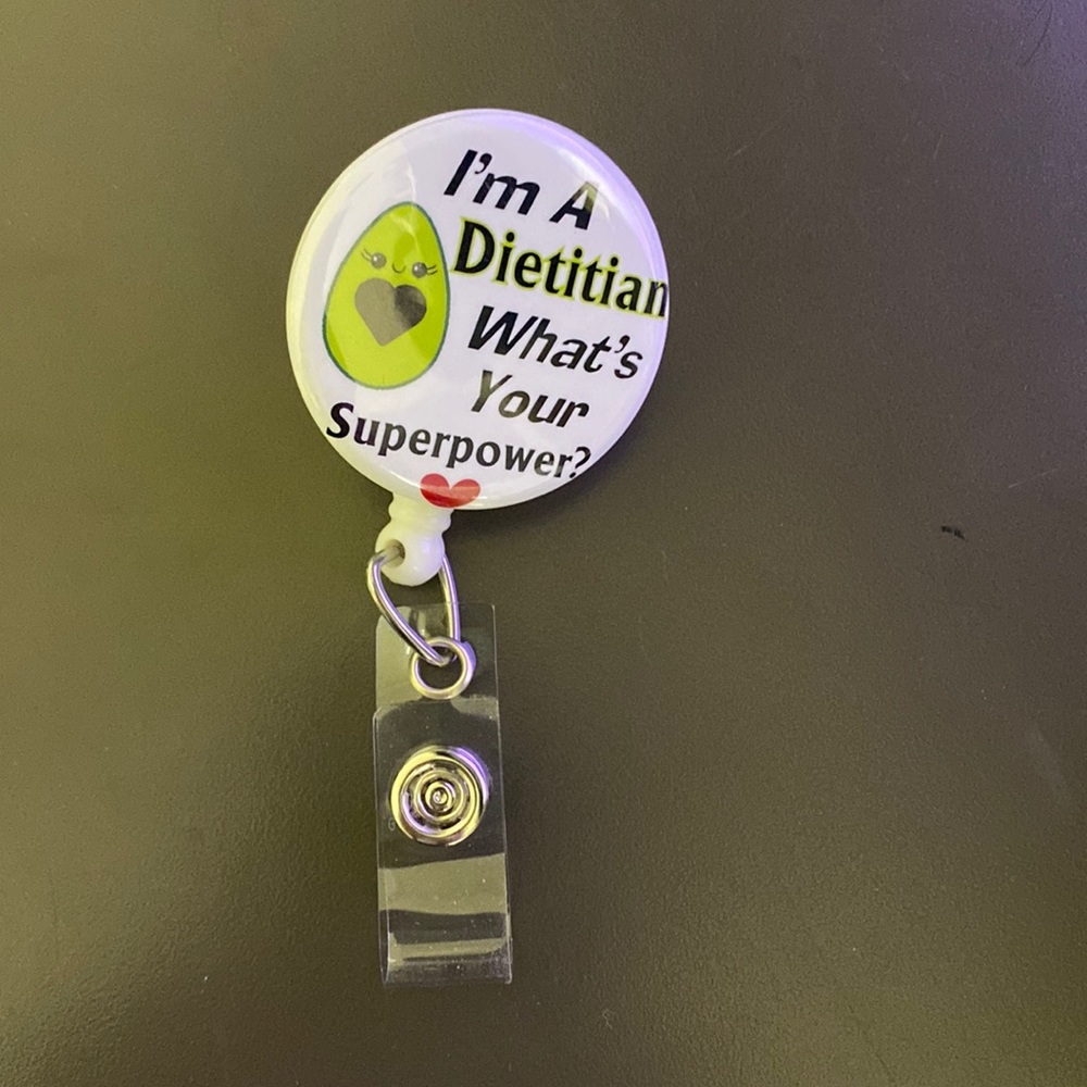 Badge holder with retracting cord!